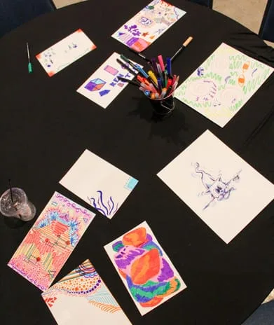 a table covered in drawings