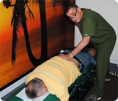 Dr. Reyna adjusting a patient
