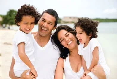 family laughing standing on beach, Family Dentist Nottingham, MD