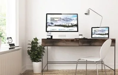 home office desk with computer and tablet screen