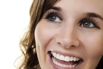 close up of beautiful dark haired woman's face, smiling white straight teeth, periodontics Gardnerville, NV dentist