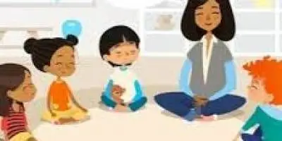 children and adult sitting on floor