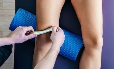 Chiropractor-use-tools-for-massaging-the-patient.