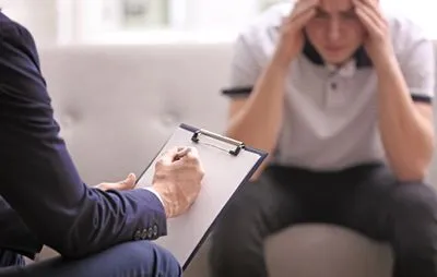 Therapist helping man cope with stress
