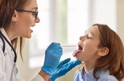Pediatric check-up for tonsillitis diagnosis