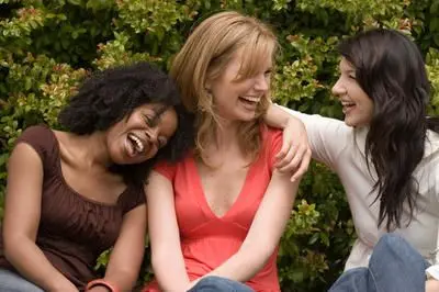 Three women laughing