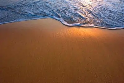 Waves on a smooth, sand beach