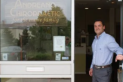 Dr. A at door of Andreano Chiropractic