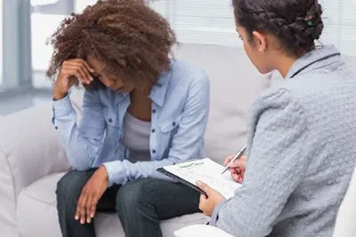 Distressed female client in a counseling appointment