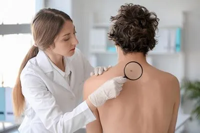 Doctor checking the back of the patient