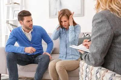 Partners consulting therapist for guidance during relationship issues.