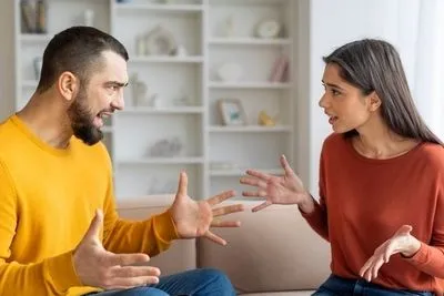 Man and woman agruing eah other on home