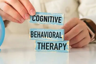 Wooden block with "Cognitive Behavioral Therapy" text printed on it
