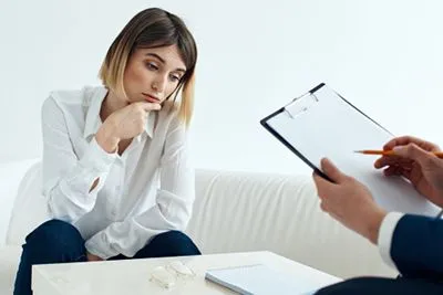 Corporate woman receiving therapy for stress management