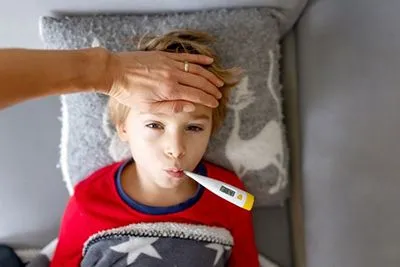 Mom caring for child with fever