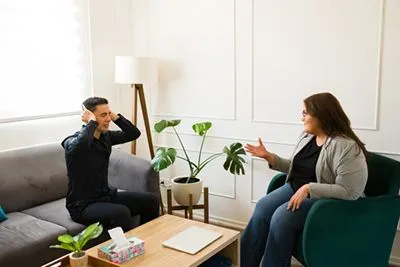 Man experiencing panic attack during cognitive behavioral therapy