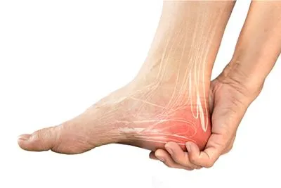 Heel pain in a person with highlight in red