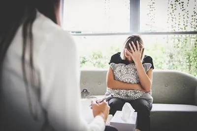 Woman receiving faith-based counseling for depression