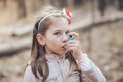 Child using Rescue Inhaler