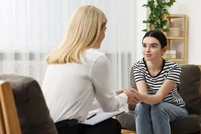 Young teenager receiving guidance to build self-esteem during life changes