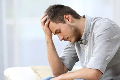 Side view of man experiencing anxiety and depression