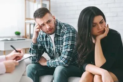 Marriage counseling session with couple and therapist