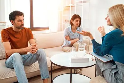 Couple experiencing relationship challenges during guided counseling session