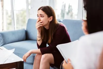 Female client in a safe space during trauma therapy