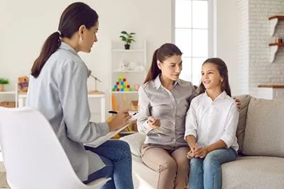 Mother attending therapy with child for ADHD