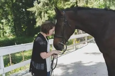SHOLEH LULHAM touching heads with horse