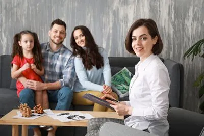 Therapist guiding open communication among family members in counseling.