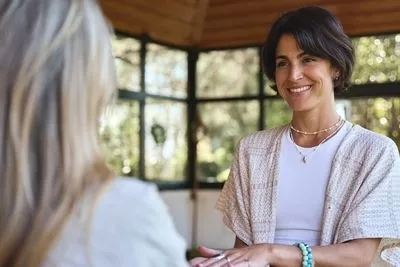 Therapist holding the hand of patient