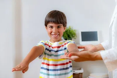 Child during his phsyical exam with pediatrician