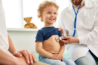 Pediatrician providing care to a young child