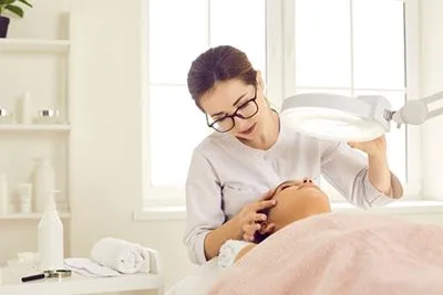 Doctor checking the skin condition of a patient
