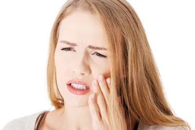 Photograph of woman holding jaw in pain, Root Canals, Chicago, IL