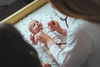 Newborn care visit with pediatrician during baby’s first checkup