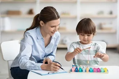 Therapist conducting play therapy session with child