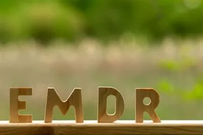 Wooden EMDR letters displayed outside