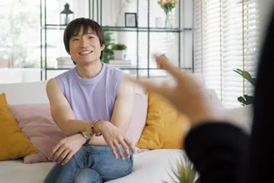 LGBTQ+ client receiving affirming mental health care during therapy session