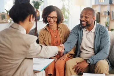 Therapist talking with couple during relationship counseling session