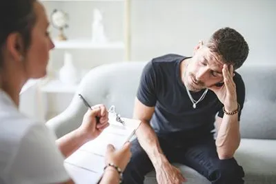 Male client receiving therapy for stress management