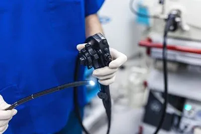 Doctor holding the colonoscopy machine