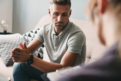 Man receiving counseling for substance abuse recovery