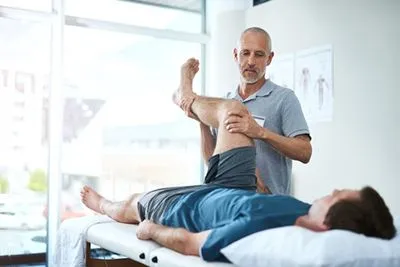 Injury rehabilitation therapy for male client
