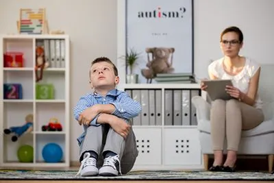 Pediatrician evaluating a child with autism spectrum disorder