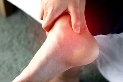 Person suffering from achilles tendonitis
