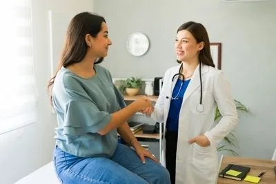 Patient talking to a female doctor on clinic