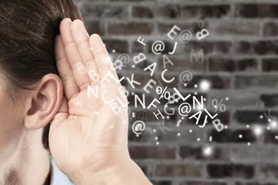 Confused woman struggling to understand sounds due to auditory processing disorder