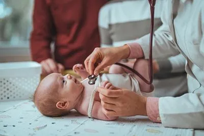 Newborn being examined by a pediatrician